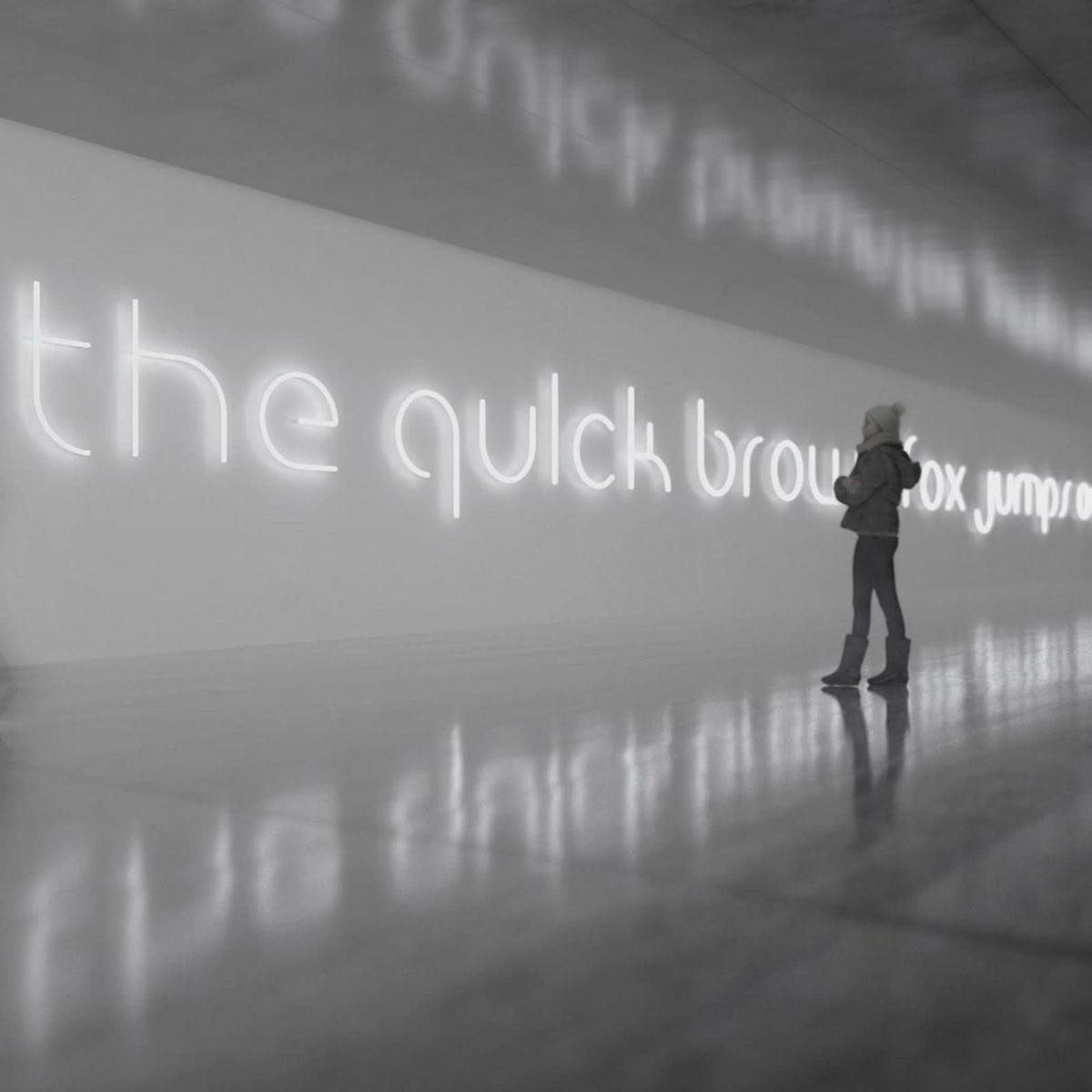 Vue en perspective d'une phrase lumineuse blanche sur un mur, avec une personne au loin.