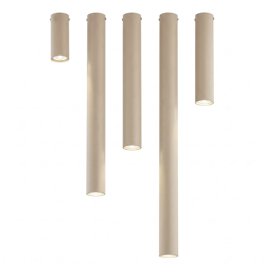 Gamme de cinq cylindres beige sur fond blanc, du plus court au plus long.