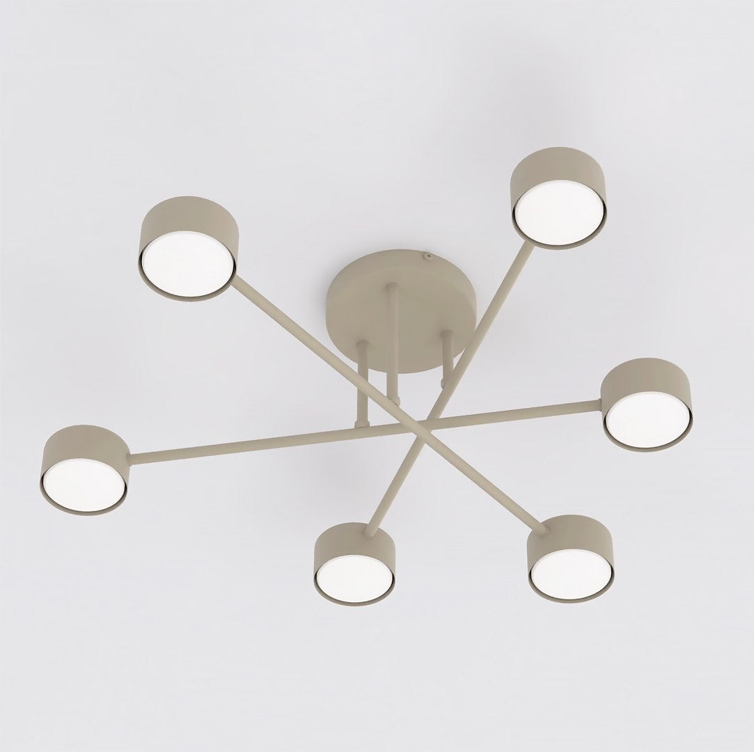 Vue plongeante montrant les six diffuseurs ronds allumés du luminaire beige