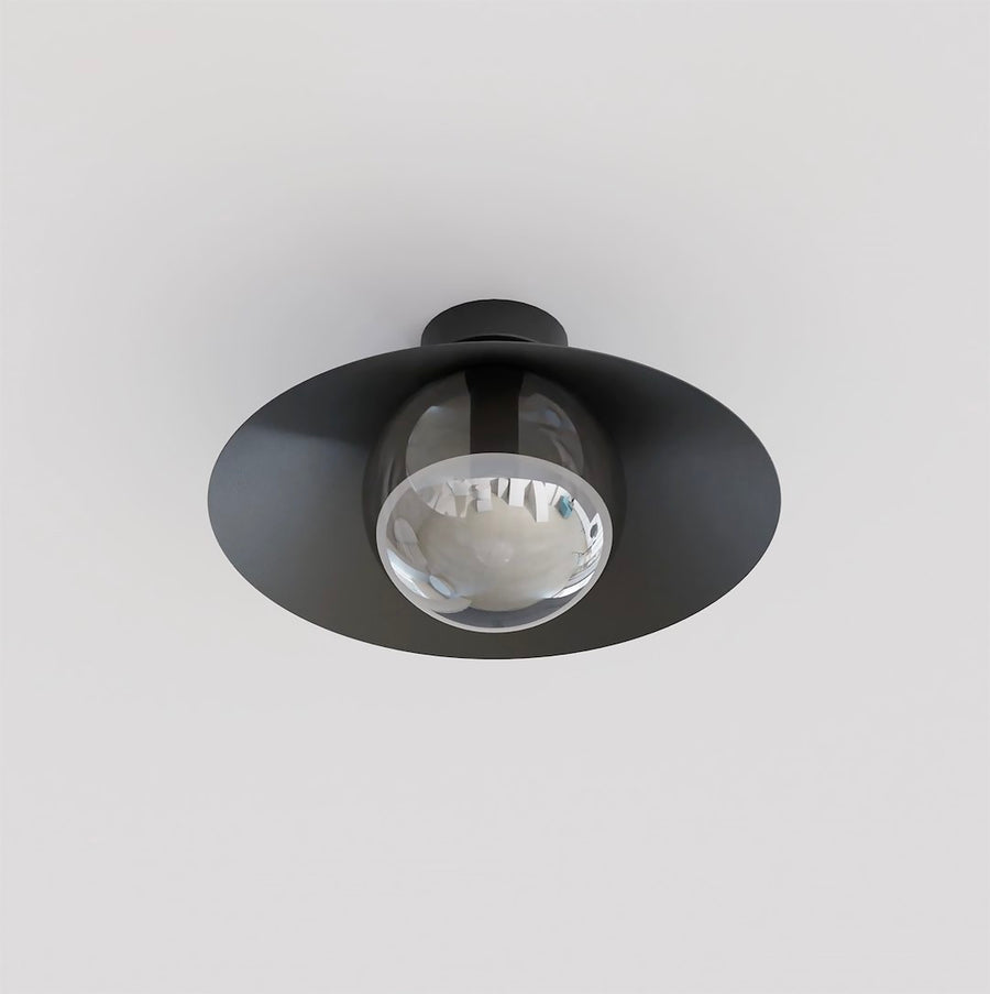 Vue de dessous montrant l'abat-jour conique noir et le globe de verre fumé