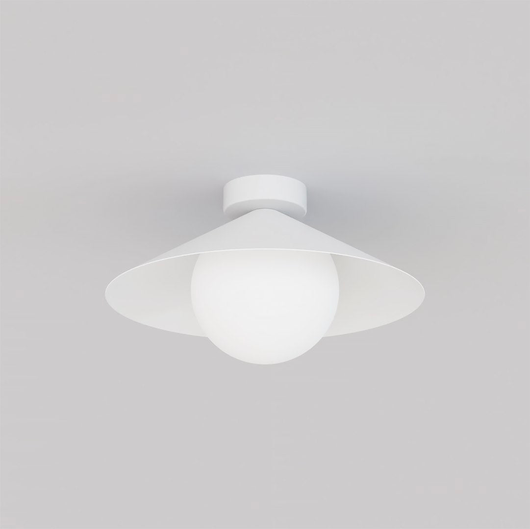 Vue rapprochée du diffuseur en verre blanc opalin sous l'abat-jour conique