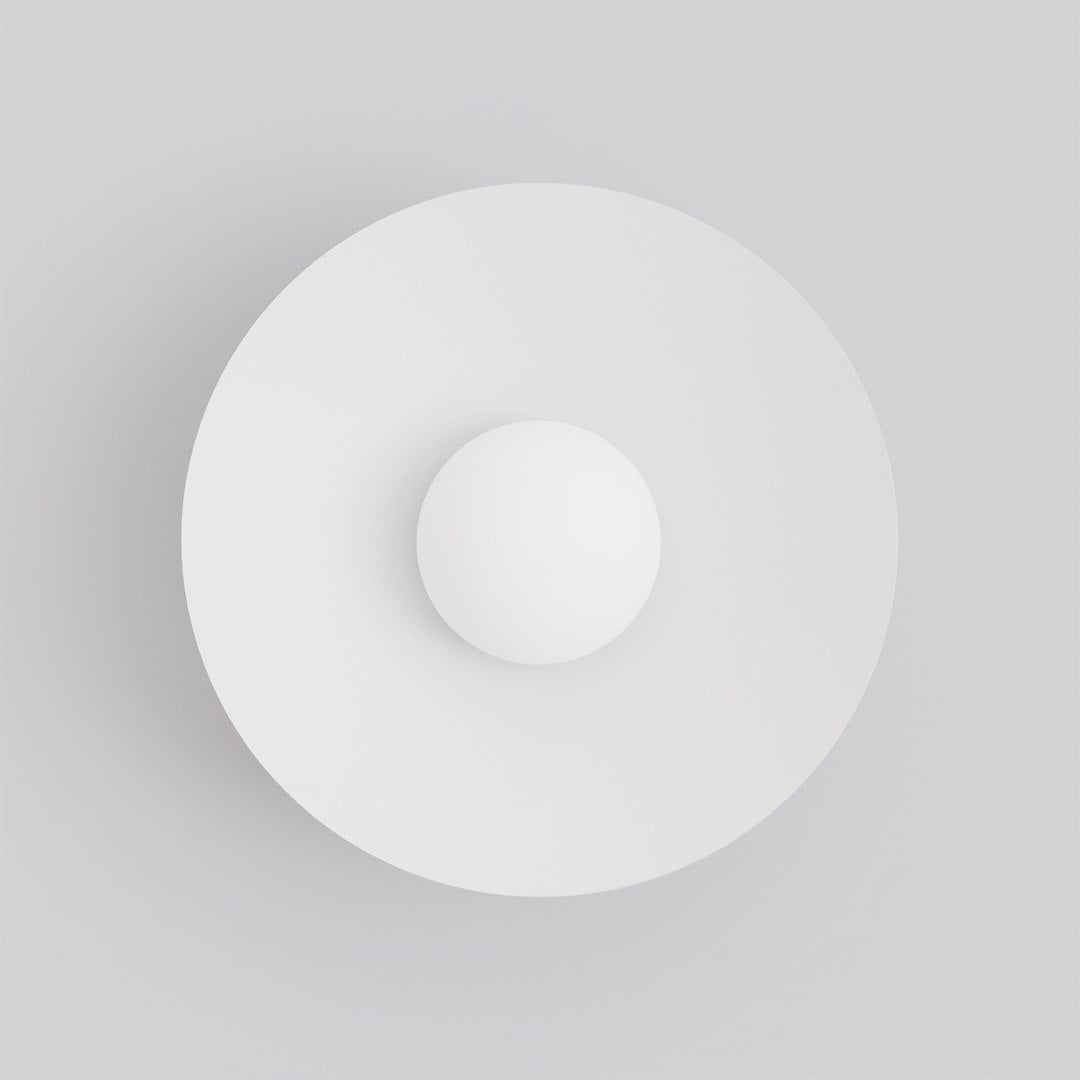 Vue de face montrant le disque rond blanc et la sphère en verre opalin