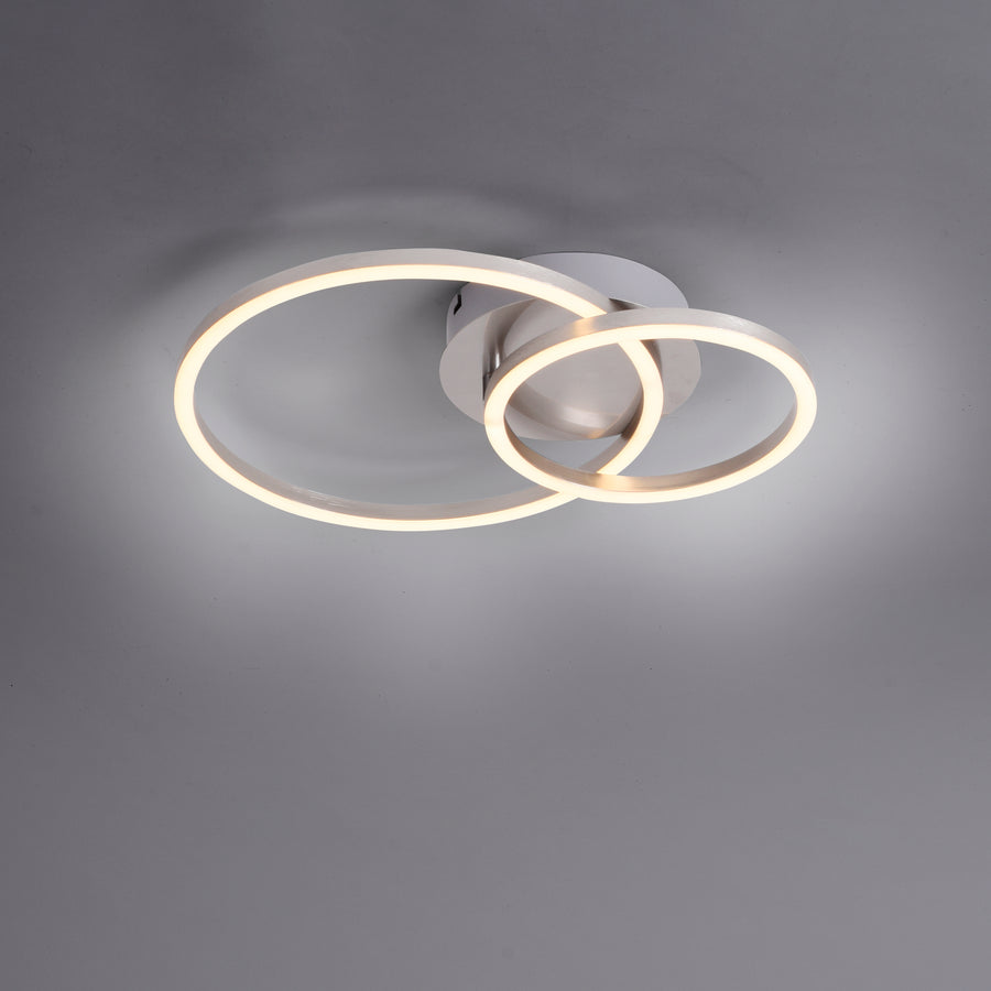 Vue de face sur fond gris, les deux anneaux LED entourant la base centrale.