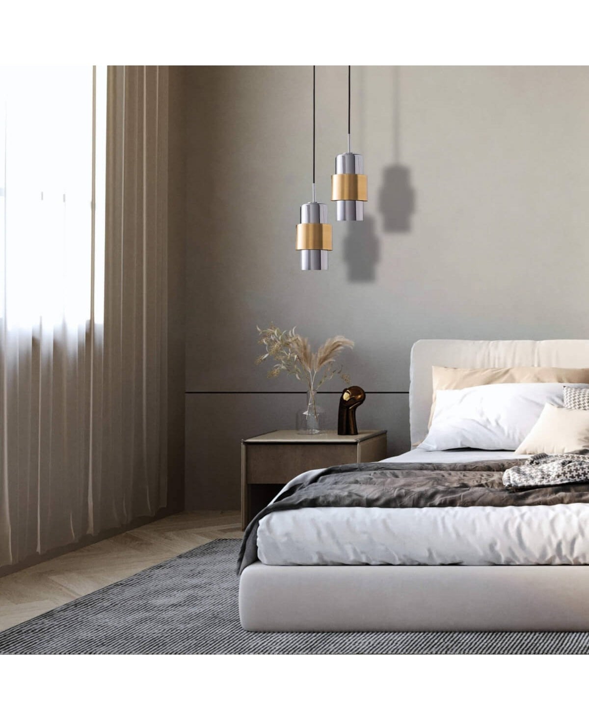 Ambiance de chambre épurée, suspensions dorées et lit blanc baignés d'une lumière douce