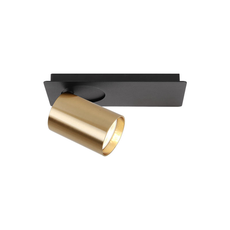 Spot orientable vu de trois quarts, embase noire plate et projecteur cylindrique doré incliné