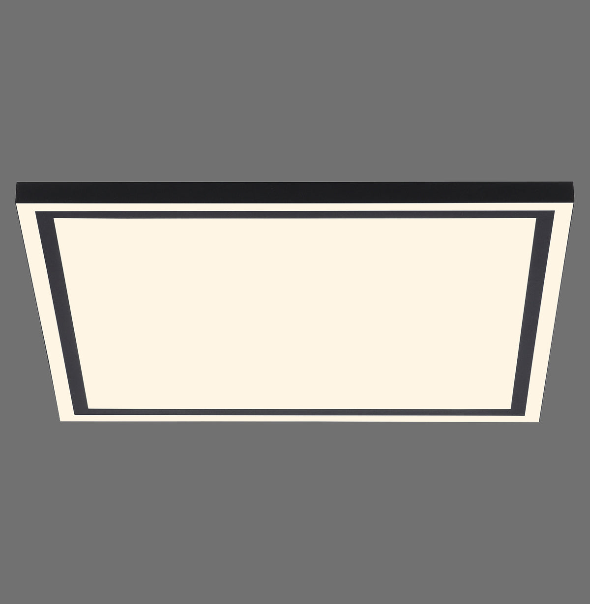 Vue de face du luminaire carré noir avec diffuseur blanc, sur fond gris.