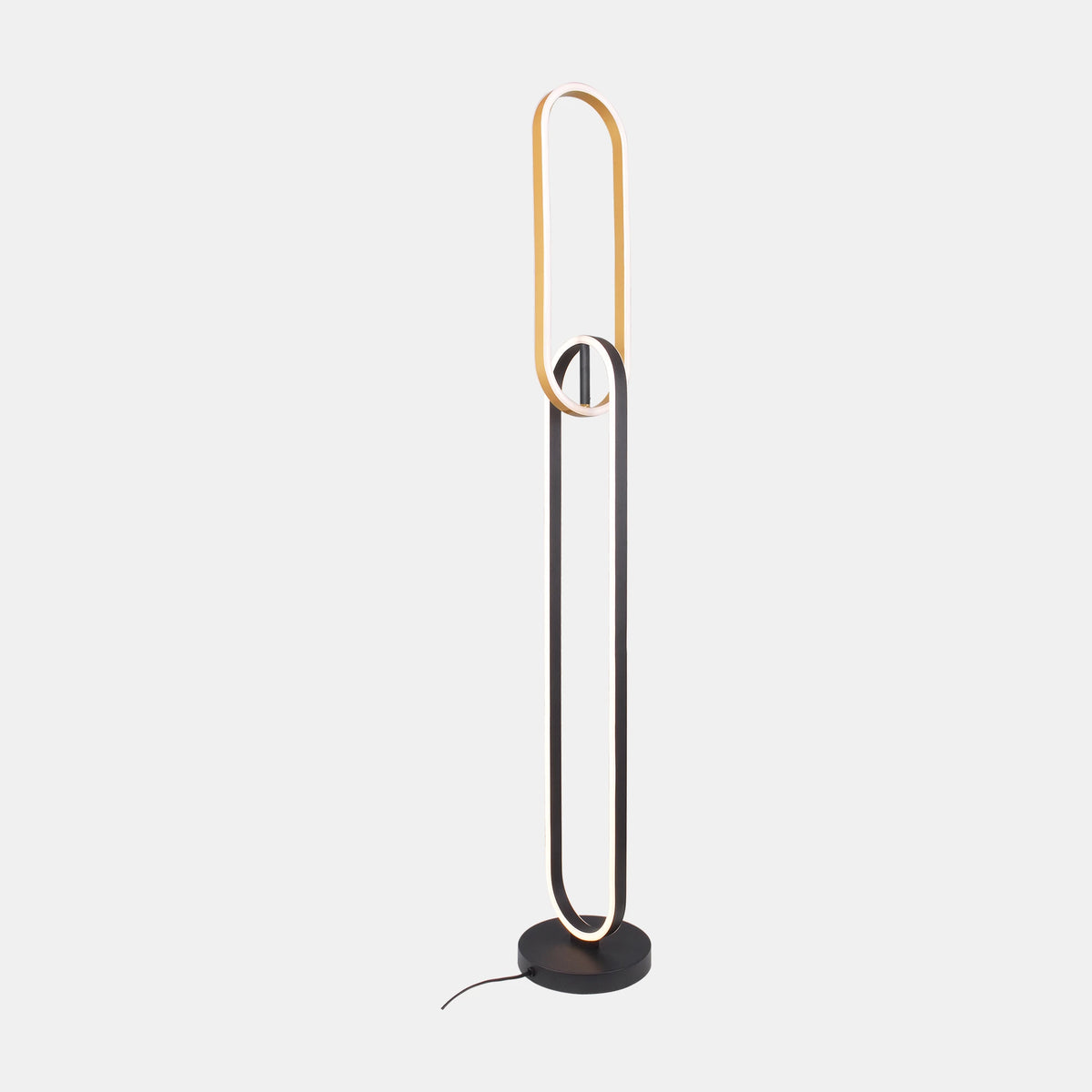 Lampadaire entier de face, boucle verticale dorée et noire allumée sur fond clair