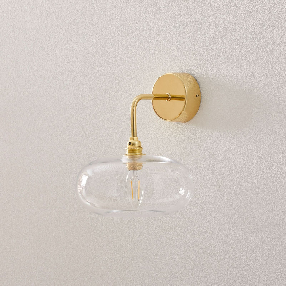 Applique murale Horizon en métal, doré et transparent, Ø 21 cm