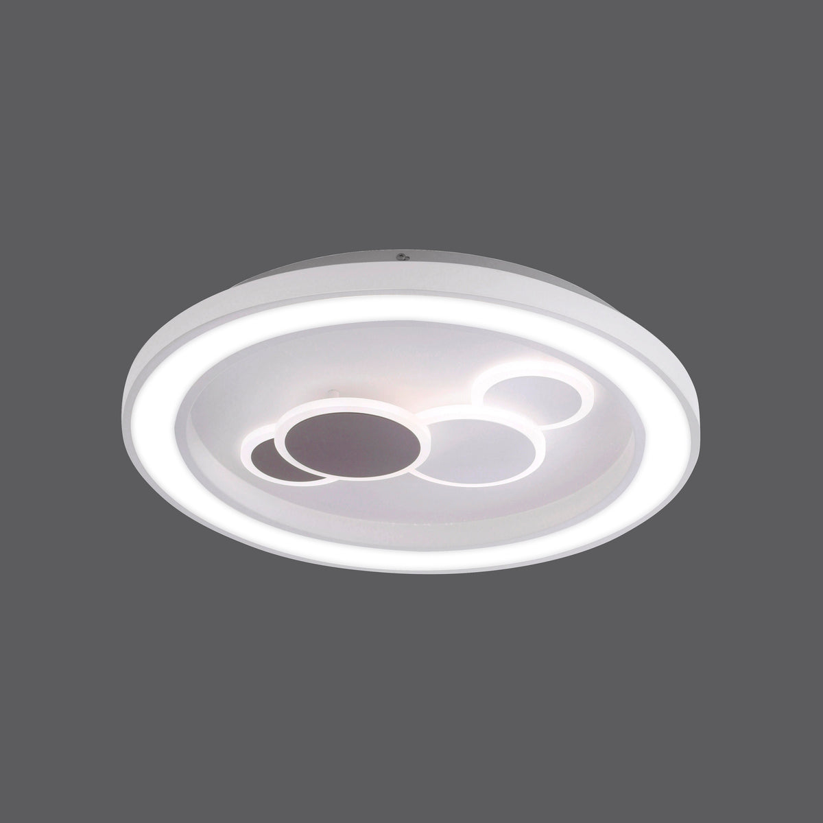 Vue rapprochée du plafonnier blanc rond avec anneau lumineux et cercles décoratifs centraux.