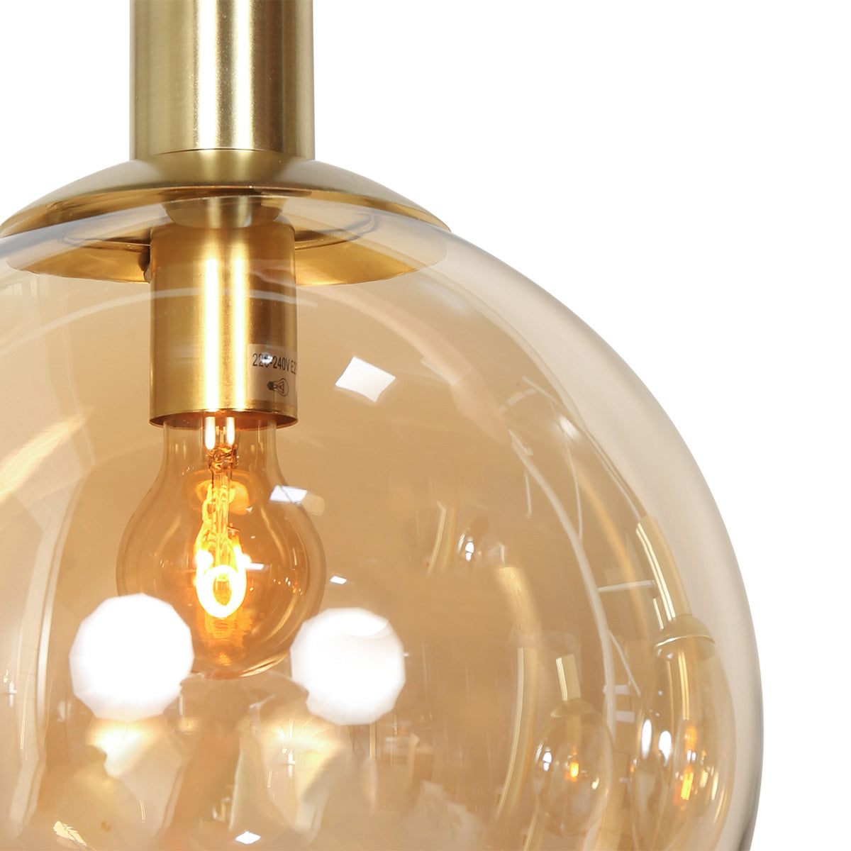 Boule en verre ambré et douille laiton E27 de la suspension Bollique – Designix.fr