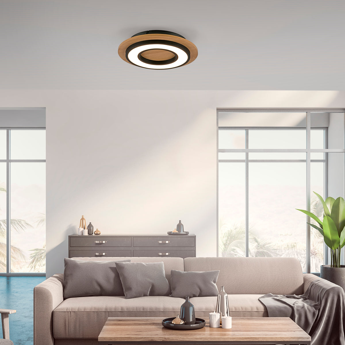 Mise en ambiance dans un salon contemporain, plafonnier fixé au plafond, lumière allumée