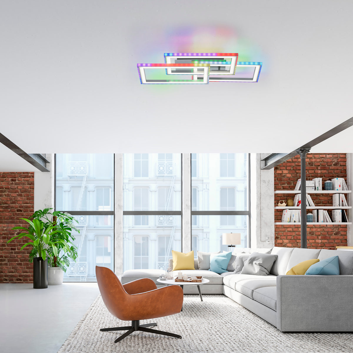 Mise en ambiance du plafonnier dans un salon moderne, canapé gris et fauteuil en cuir