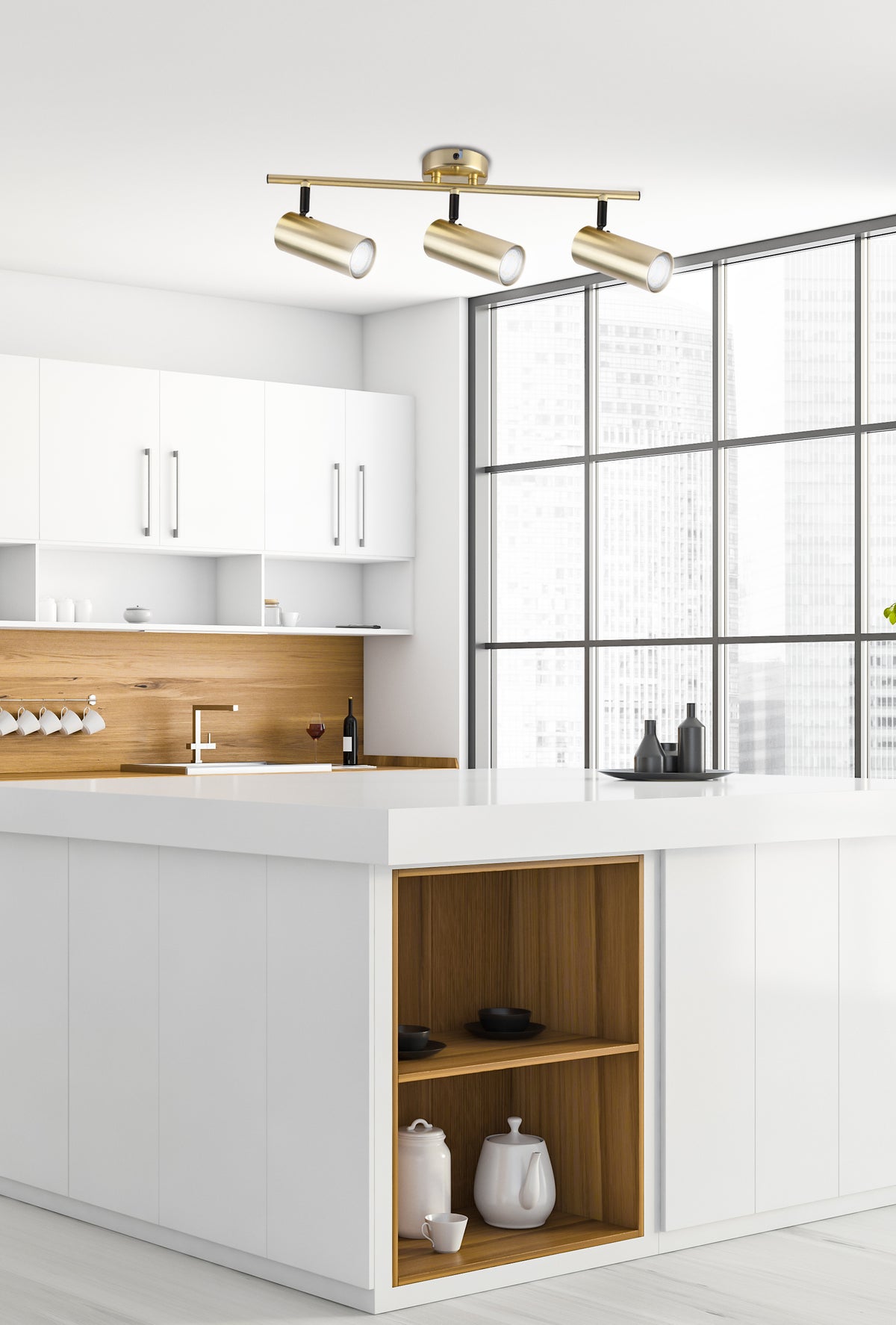 Luminaire suspendu au plafond d'une cuisine blanche, îlot central et grandes fenêtres.