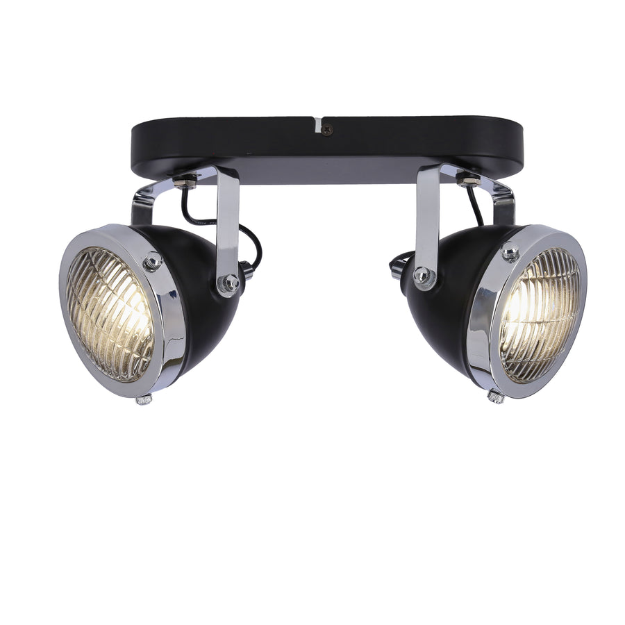 Spots allumés diffusant une lumière chaude à travers la grille métallique