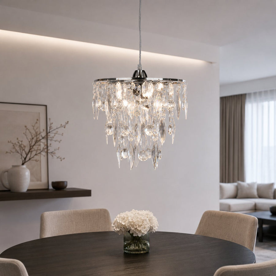 Luminaire allumé au-dessus d'une table ronde en salle à manger contemporaine