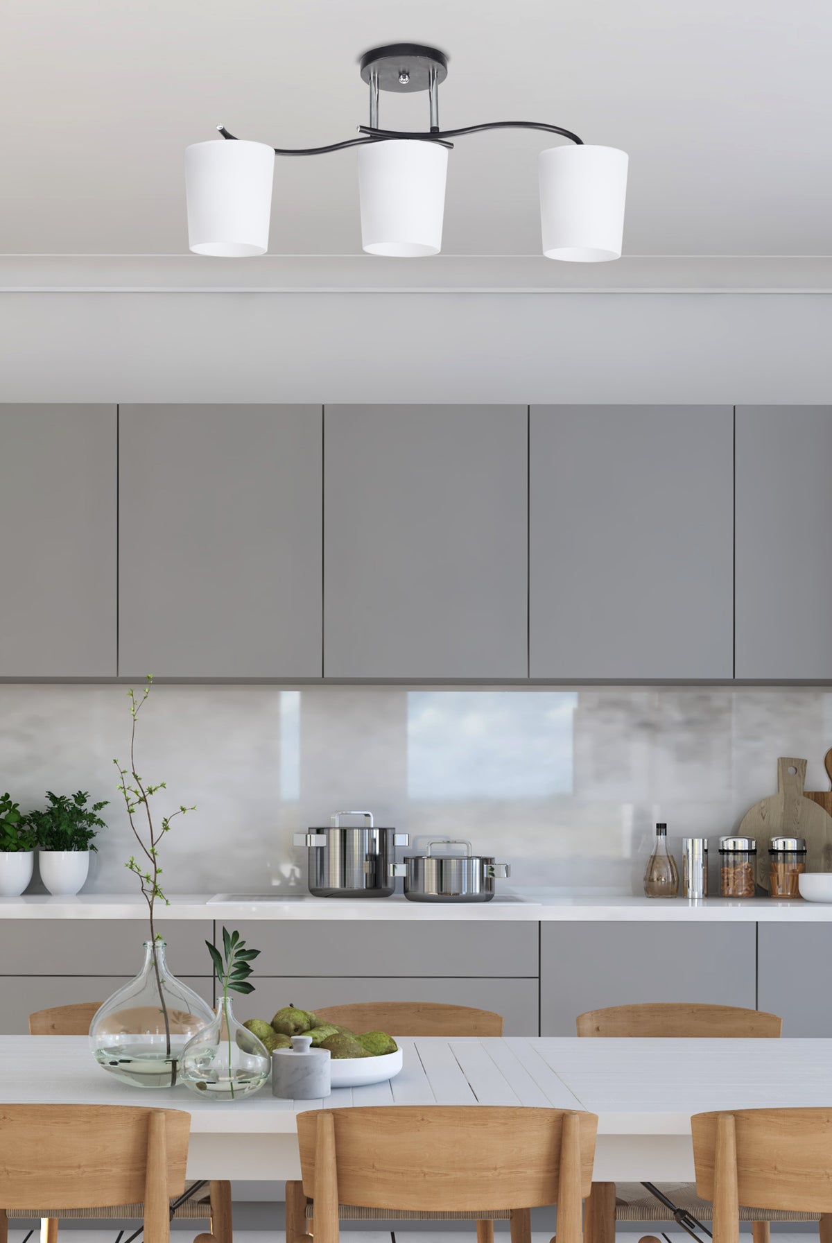 Mise en ambiance du plafonnier au-dessus d'une table de cuisine contemporaine grise