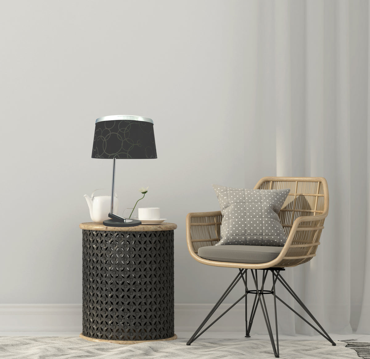 Mise en ambiance de la lampe près d'un fauteuil en rotin et d'un coussin