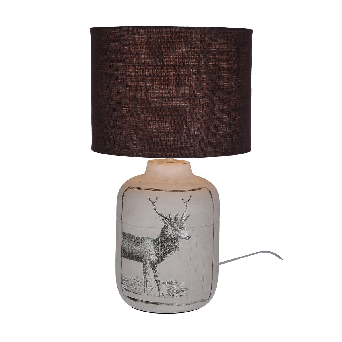 Même lampe allumée, mettant en valeur le cerf dessiné sur la base céramique