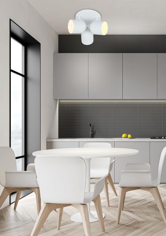 Vue d'ambiance du plafonnier au-dessus d'un coin repas de cuisine moderne