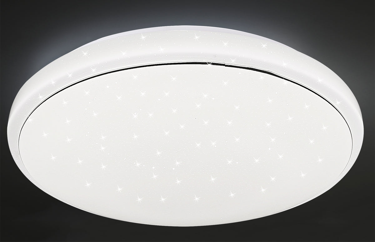 Même luminaire allumé sur fond sombre, étoiles lumineuses bien visibles