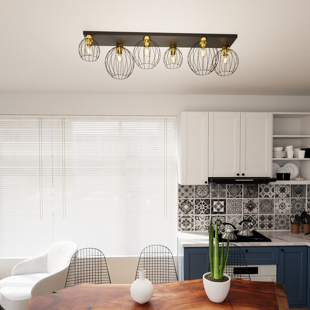 Plafonnier installé au plafond au-dessus d'un plan de travail, intérieur de cuisine contemporaine.