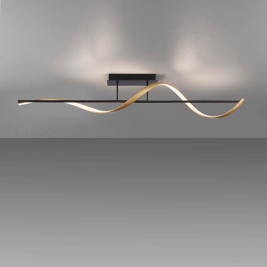 Plafonnier allumé en gros plan, halo lumineux diffusé au plafond sur fond gris