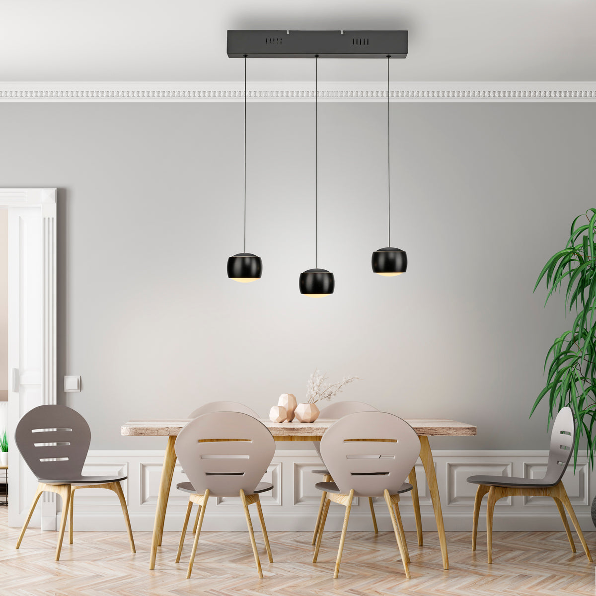 Mise en ambiance au-dessus d'une table à manger dans une salle contemporaine.