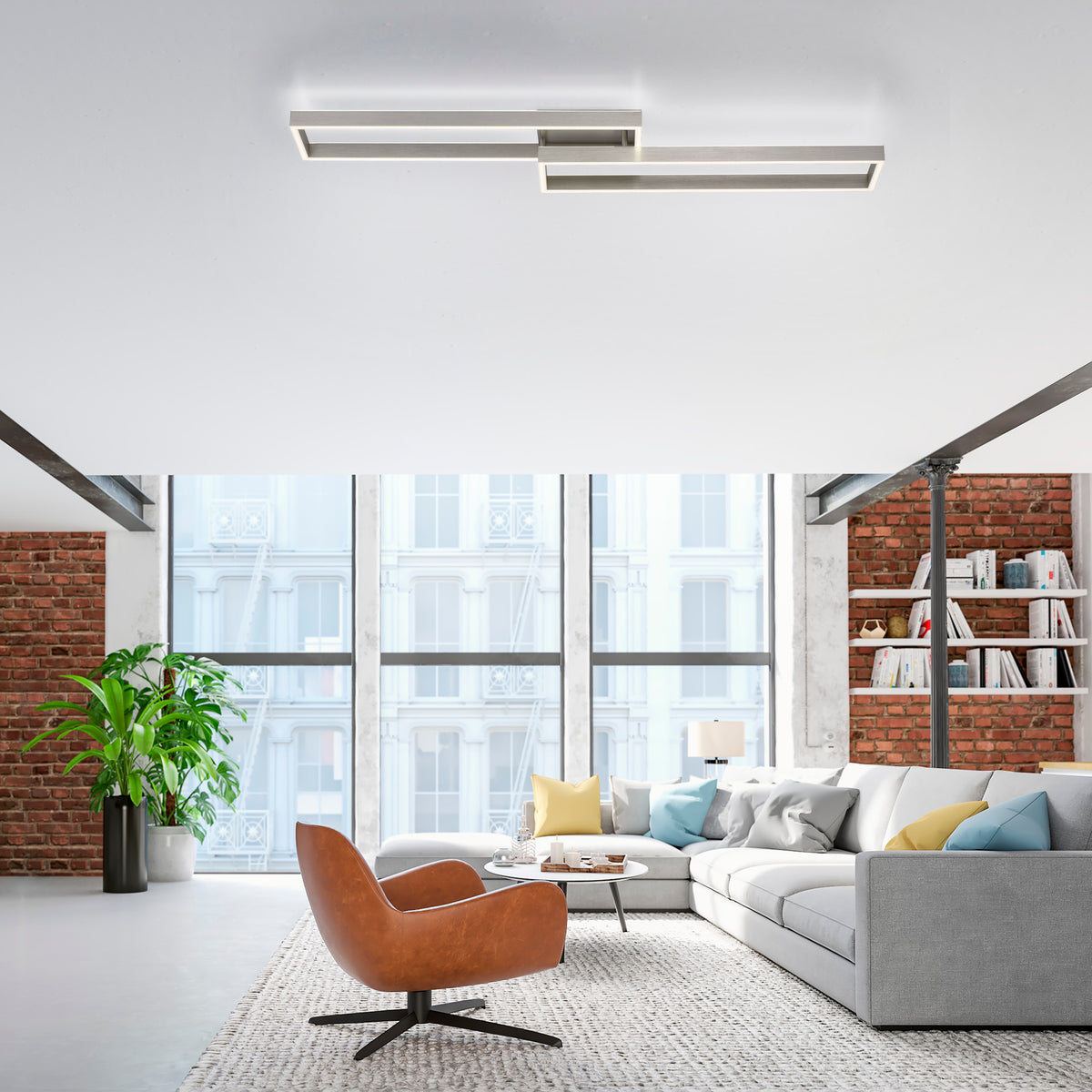 Mise en ambiance du luminaire au plafond d'un salon industriel avec canapé et fauteuil