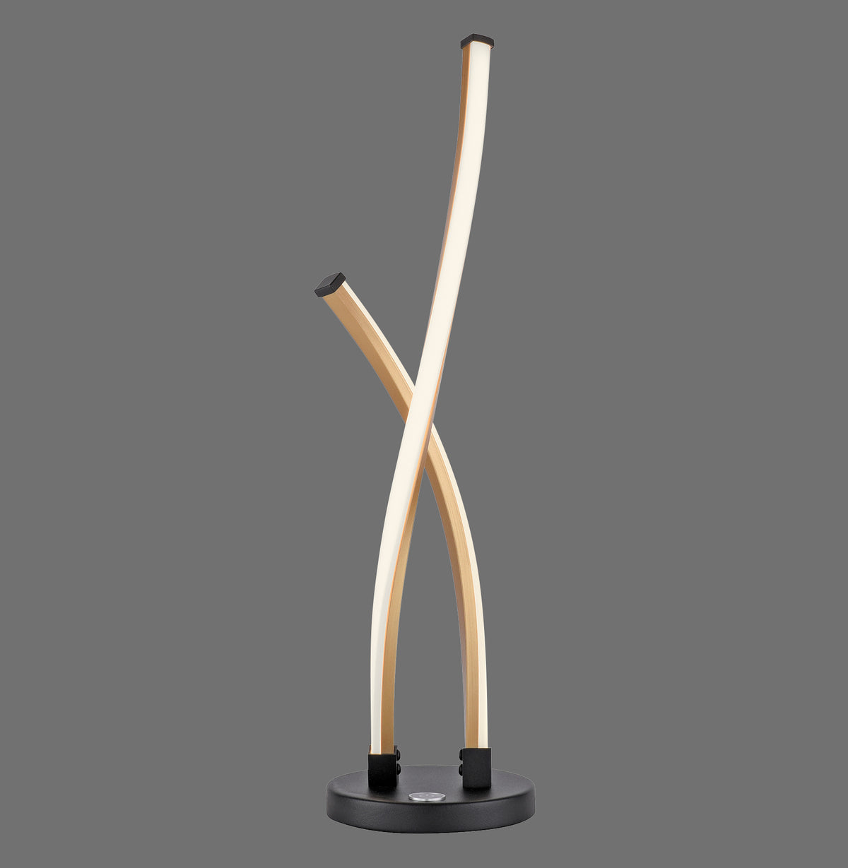 Lampe à poser dorée aux deux bras courbes croisés, vue de face sur fond gris.