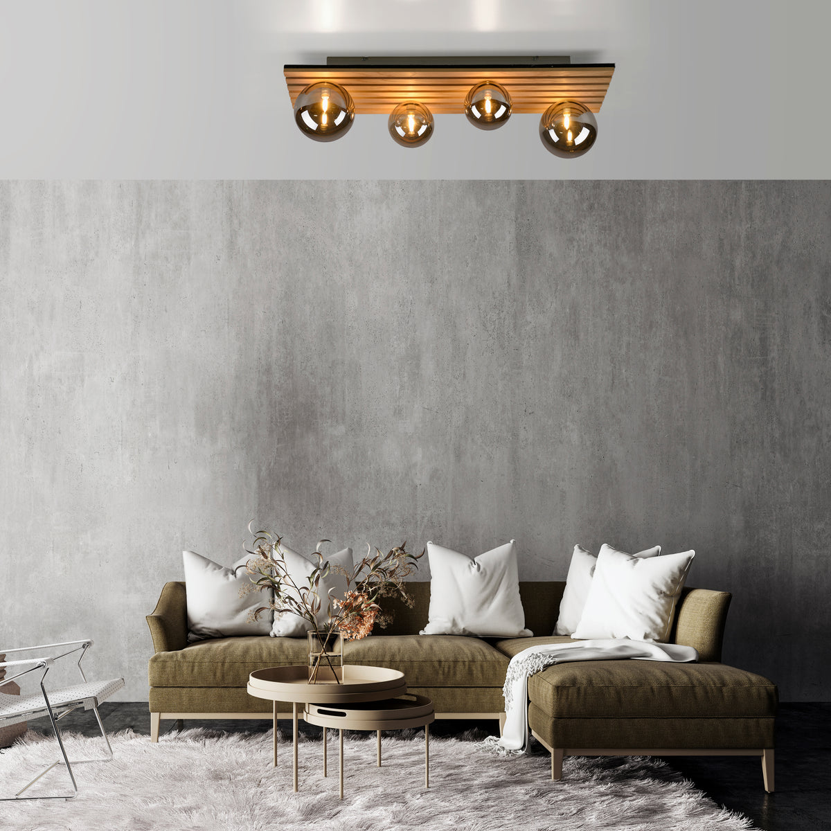 Mise en ambiance dans un salon moderne, plafonnier allumé au-dessus d'un canapé.
