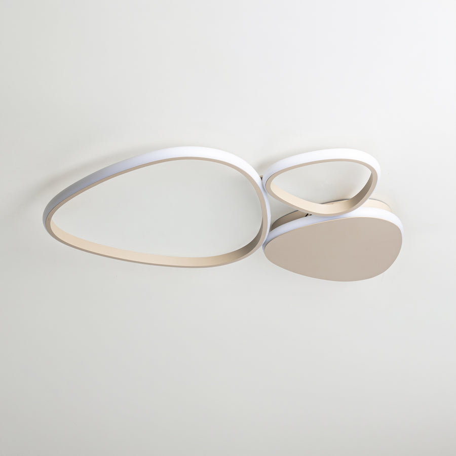 Vue de face sur fond clair, structure beige et diffuseur blanc