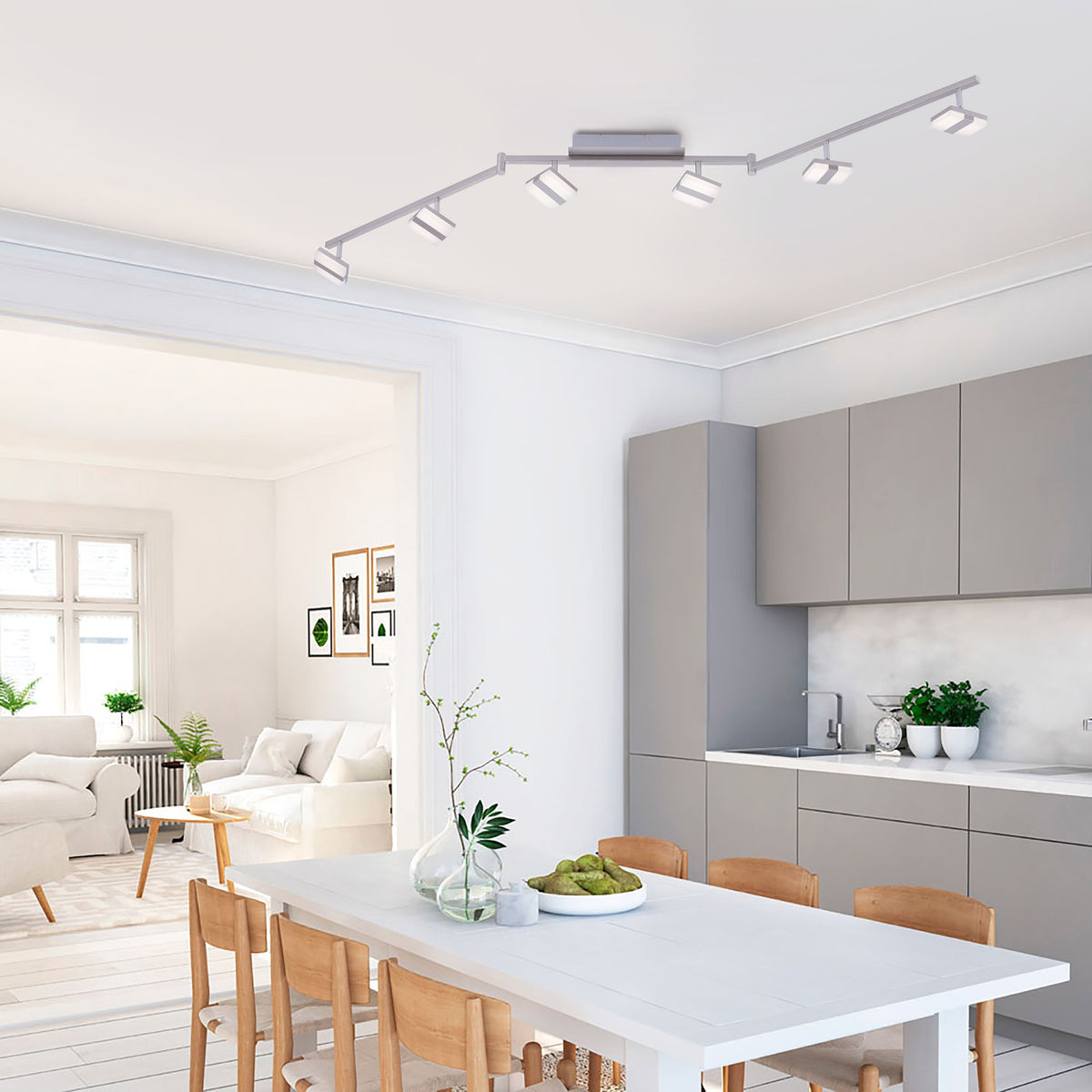 Mise en ambiance du plafonnier allumé dans une cuisine-salle à manger moderne.