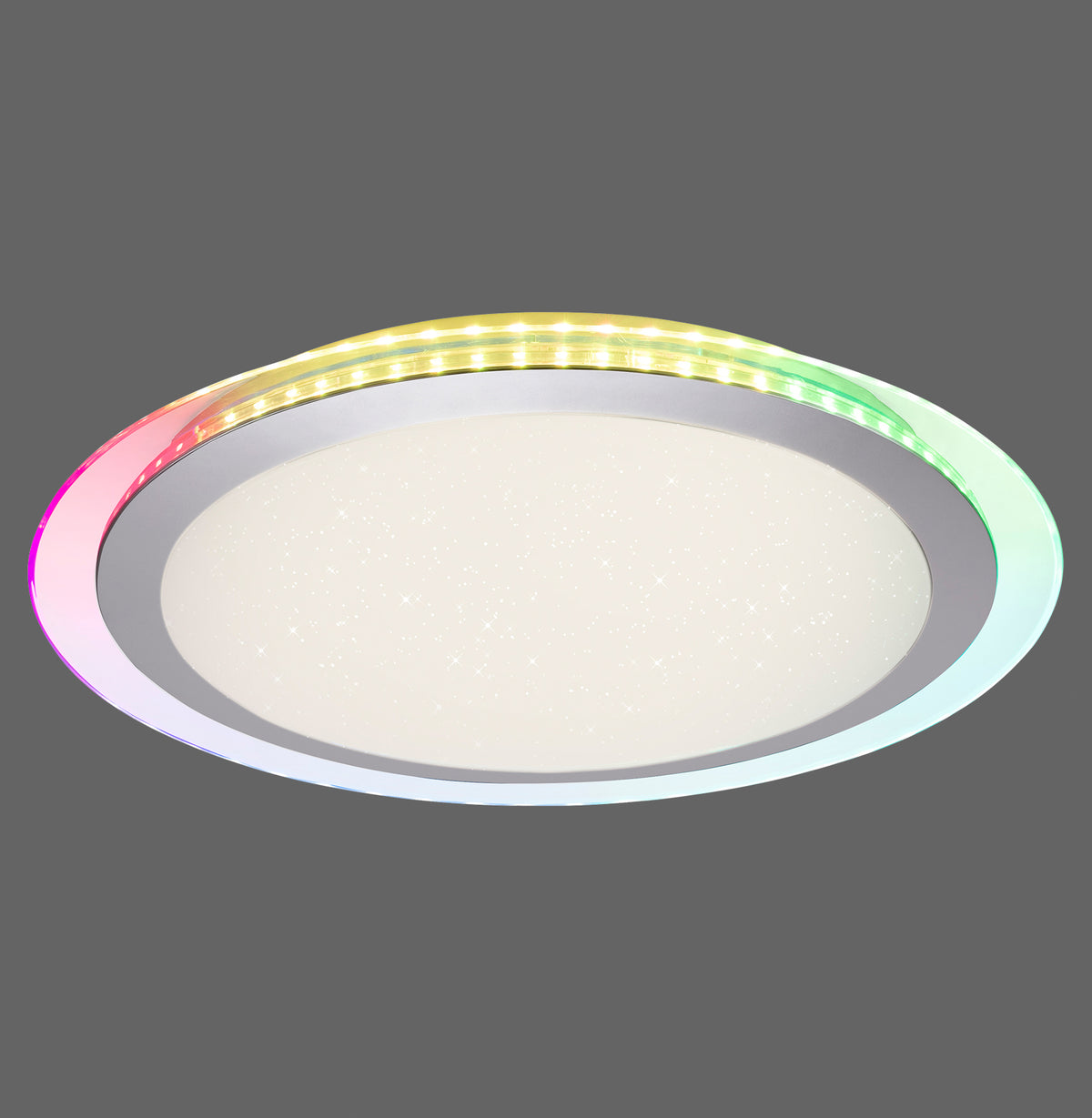 Plafonnier rond argenté, diffuseur central étoilé et anneau latéral lumineux multicolore sur fond gris.