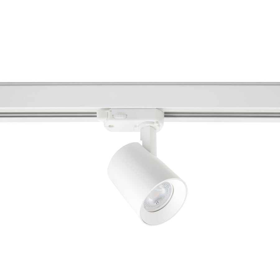 Spot blanc sur rail, tête cylindrique orientable avec ampoule GU10 visible de face.