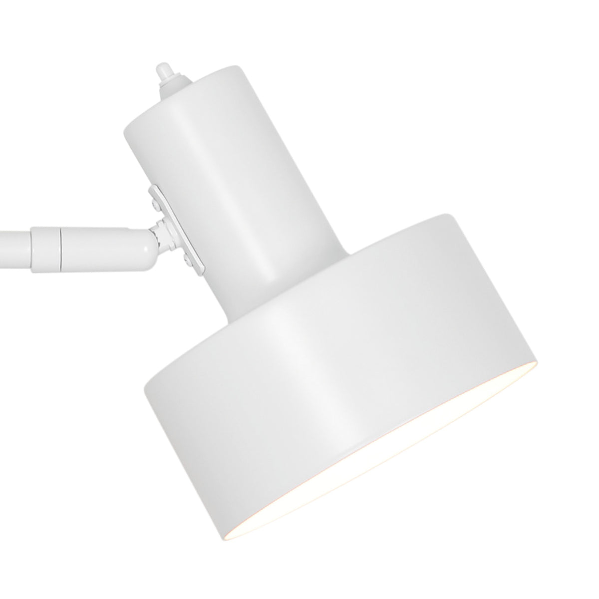 Détail rapproché de la tête cylindrique et de l'articulation réglable en blanc.