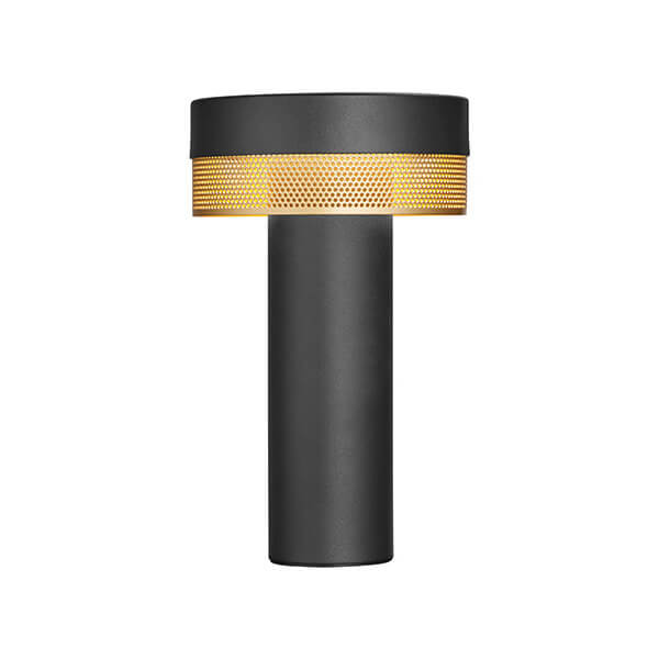Lampe noire et dorée de face sur fond blanc, montrant sa structure cylindrique et sa grille.