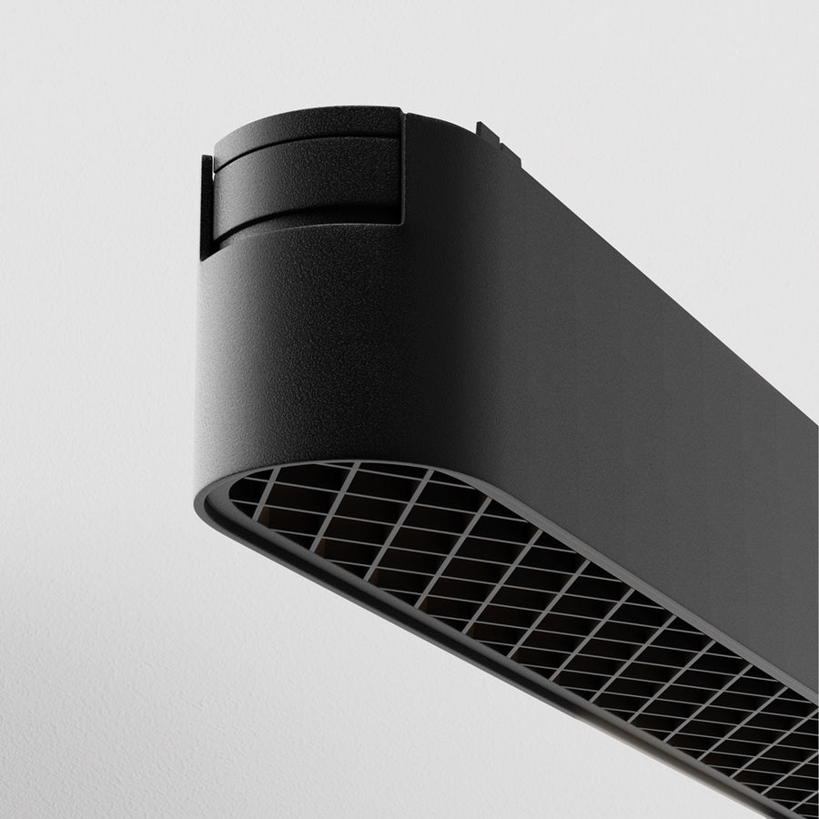Détail de l'extrémité arrondie et de la finition noire mate du projecteur