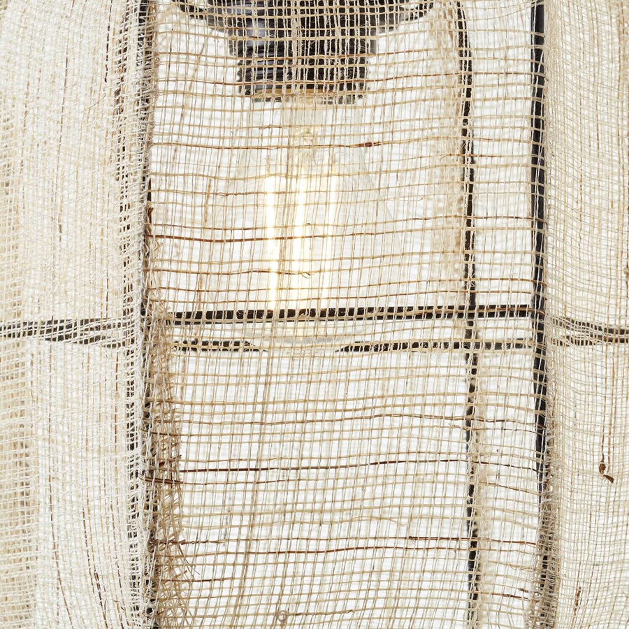 Détail macro de la fibre tissée et du cadre métallique noir de l'abat-jour