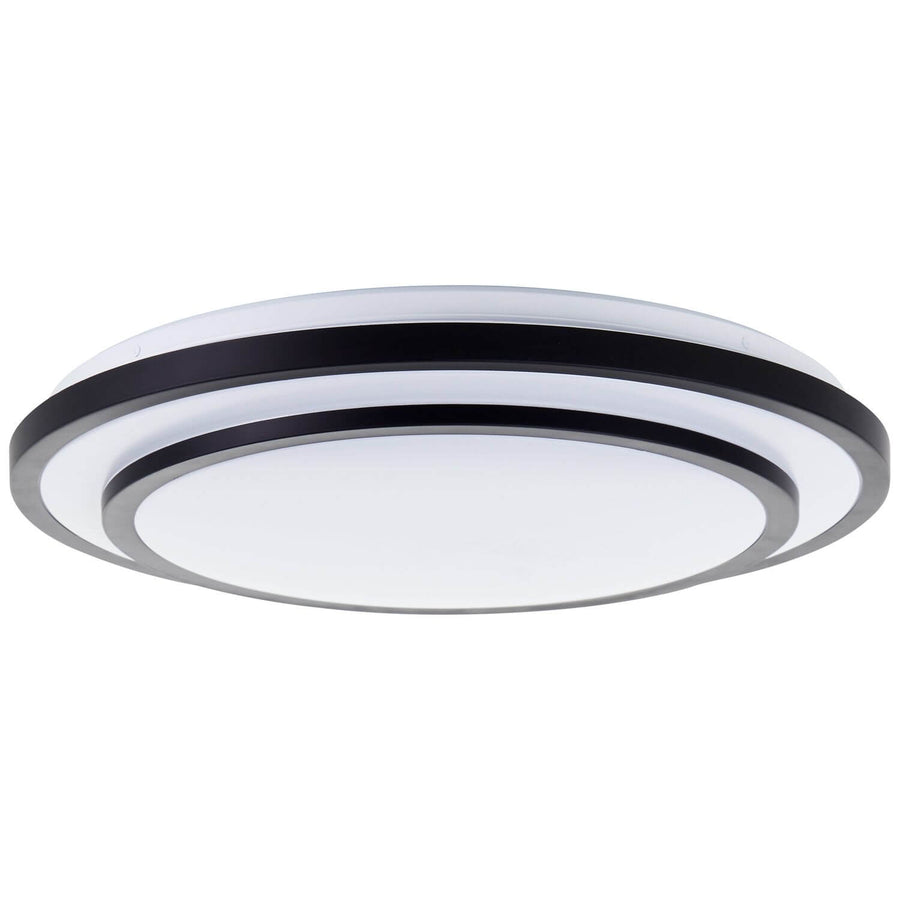 Vue de dessous du luminaire rond révélant ses anneaux noirs et diffuseur blanc.