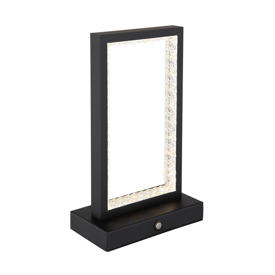 Lampe à poser noire mat de face, cadre rectangulaire et bordure en verre texturé.