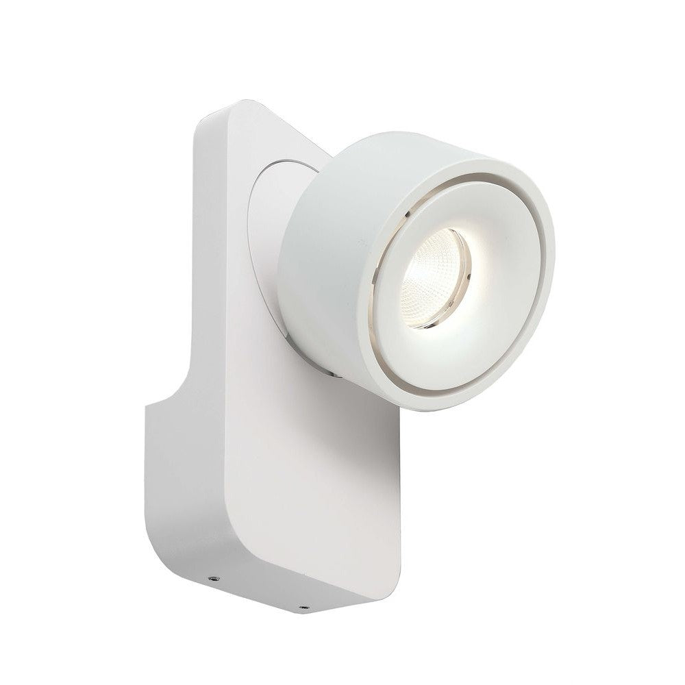 Spot mural blanc orientable, vu de trois quarts face avec sa lentille LED.