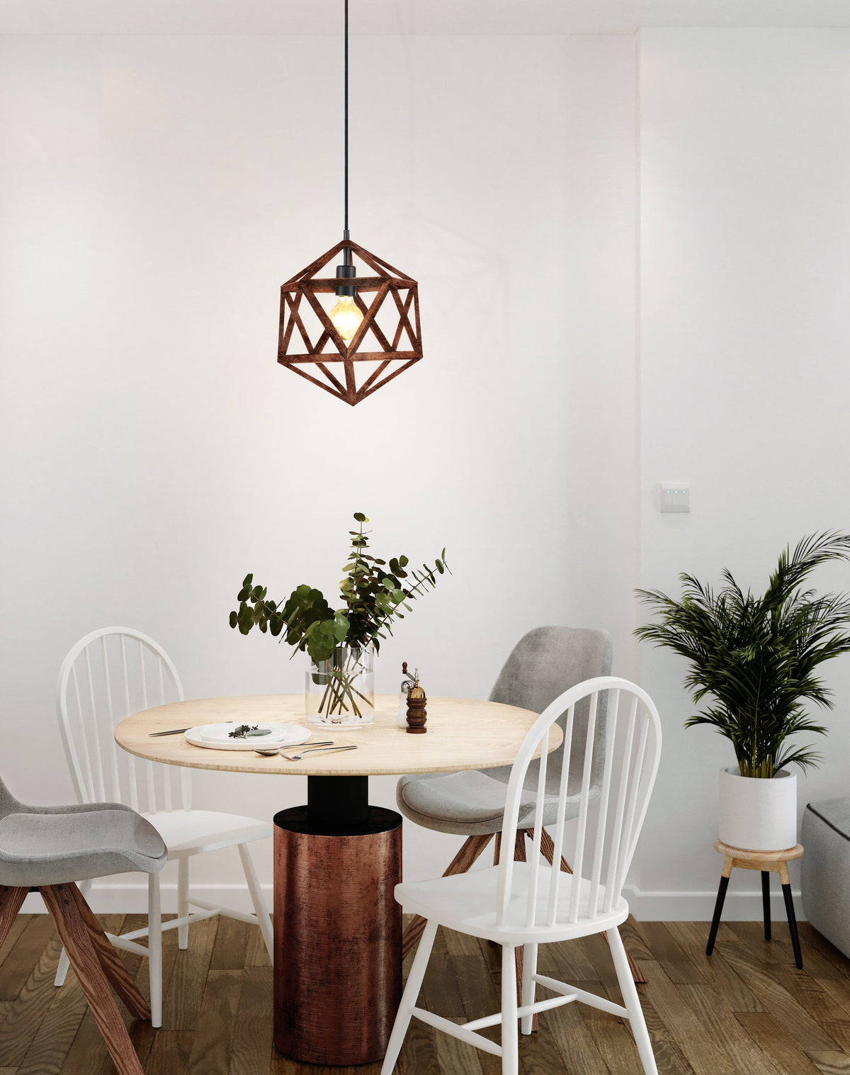 Suspension cuivrée installée au-dessus d'une table de salle à manger, ambiance chaleureuse