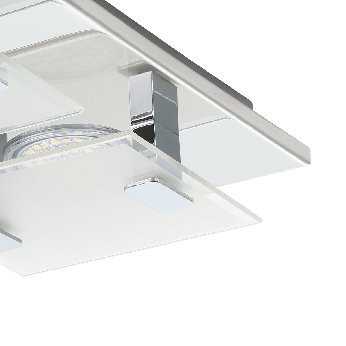 Détail de finition : module LED sous plaque de verre et support chromé