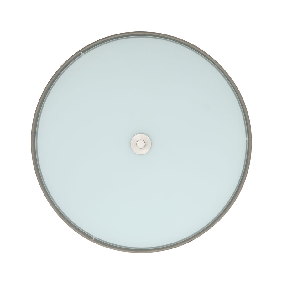 Vue de dessous montrant le diffuseur en verre rond et sa fixation métallique centrale