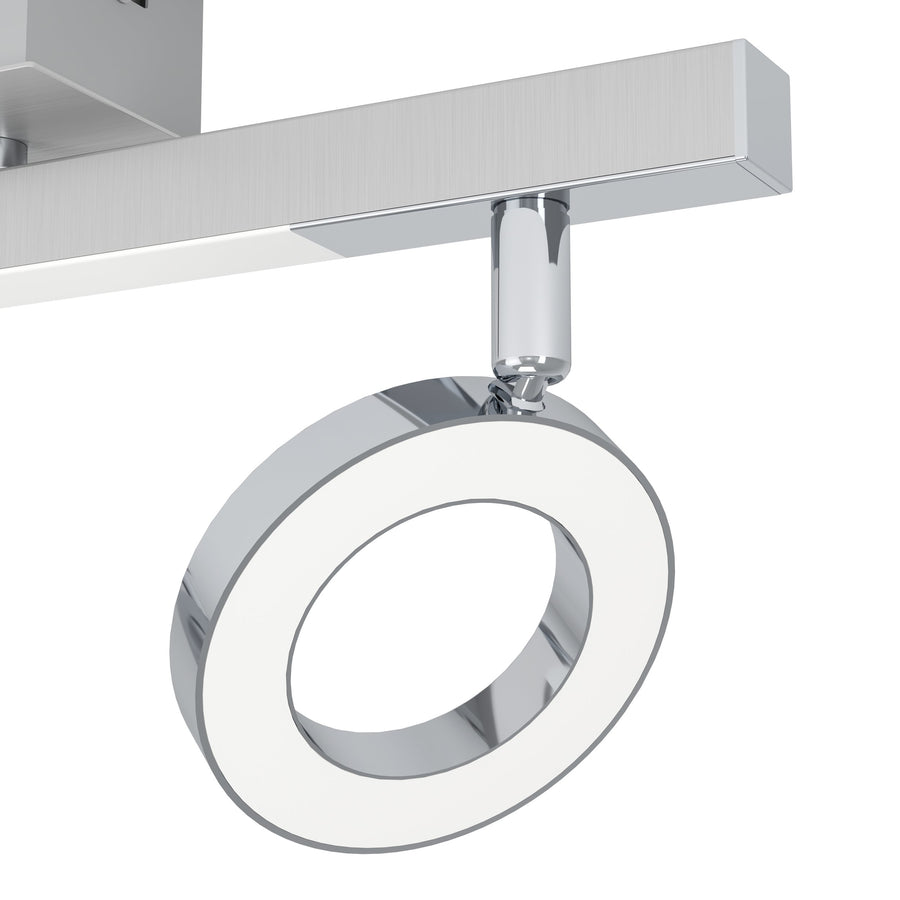 Gros plan sur un anneau chromé et son diffuseur blanc translucide éclairé