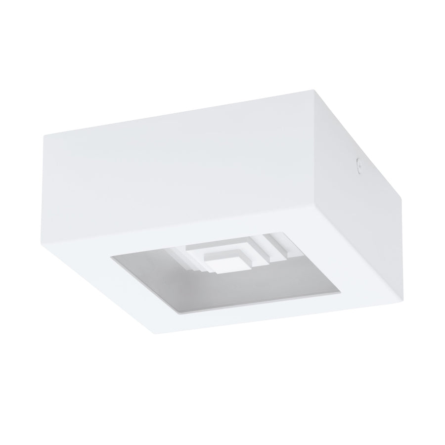 Vue plongeante montrant l'intérieur blanc et la platine métallique carrée du luminaire
