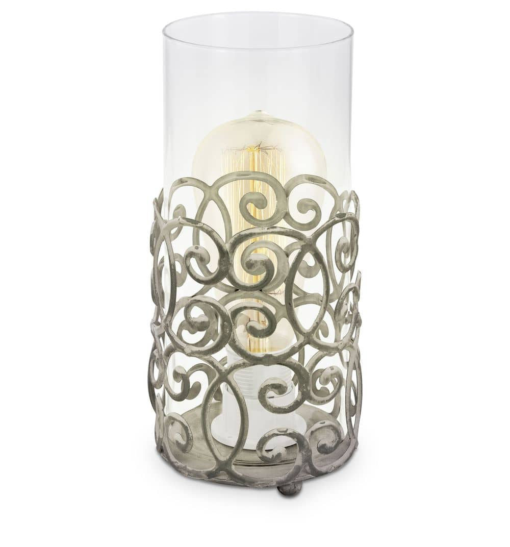 Lampe à poser de face, verre cylindrique transparent et socle métallique ajouré marron
