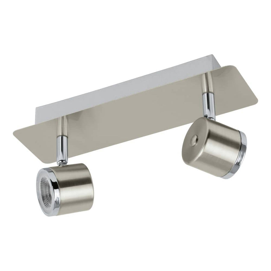 Spot double en nickel satiné, deux têtes cylindriques orientables sur embase rectangulaire.