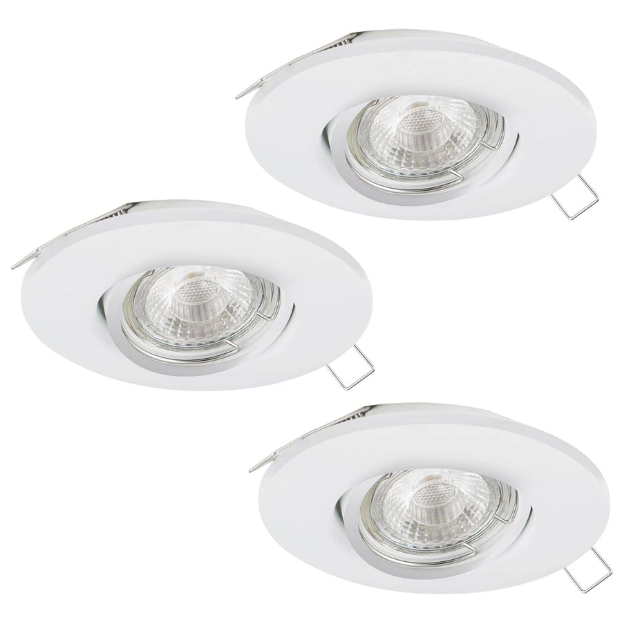 Trois spots encastrables blancs ronds avec ressorts de fixation, vus de biais.