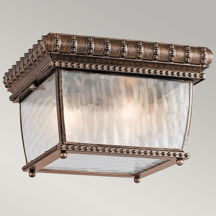Vue de face du luminaire allumé, lumière chaude diffusée à travers le verre ondulé